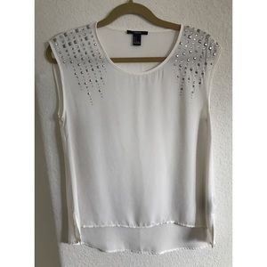 Elegant white top with silver beading